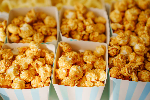 Caramel popcorn cups for a festive dessert. A simple and delicious candy bar for a party.