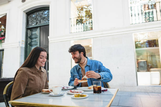 istock Hispanic Couple Enjoying Breakfast Outdoors in Madrid 2176078966
