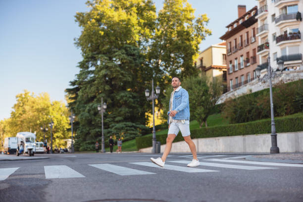 istock Hispanic Man Walking Across Street in Madrid 2176079049