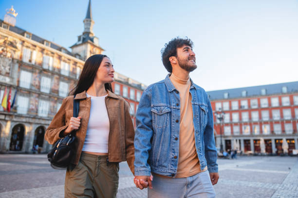 istock Hispanic Couple Walking in Plaza Mayor Madrid Enjoyment 2176079078