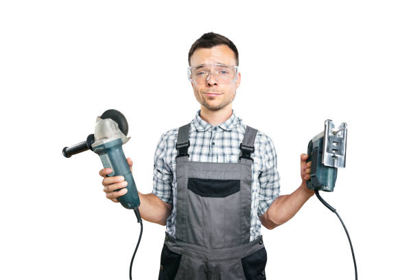 istock Portrait of a Worker Holding Power Tools Isolated on White 2176079281