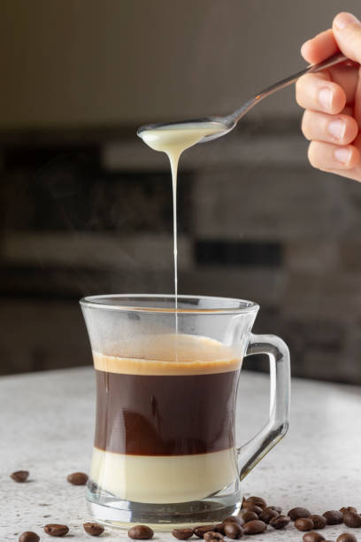 istock Delicious Layered Coffee with Cream and Coffee Beans 2176081002