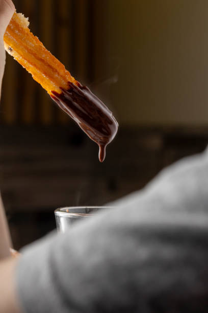 istock Hot chocolate with whipped cream and churros delight. 2176081851