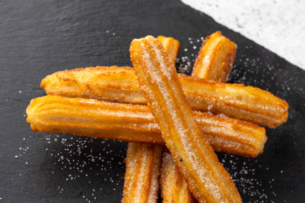 istock Hot chocolate with whipped cream and churros delight. 2176081856