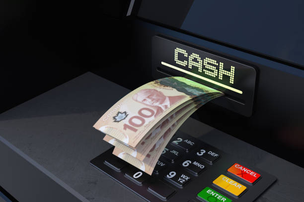 istock Withdrawal Canadian Dollar From The ATM 2176082772