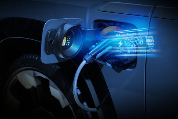 istock Power cable pump plug in charging power to electric vehicle EV car. 2176084196