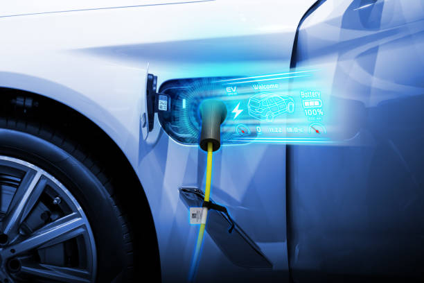 istock Power cable pump plug in charging power to electric vehicle EV car. 2176084197