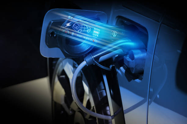 istock Power cable pump plug in charging power to electric vehicle EV car. 2176084200