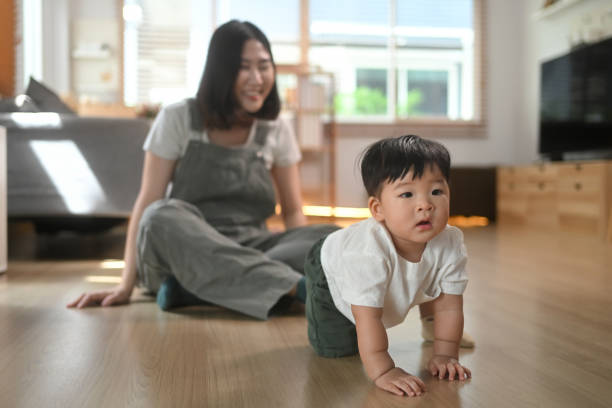 istock Adorable baby boy crawling on the floor, explore their surroundings Child development and nurturing care concept 2176084653