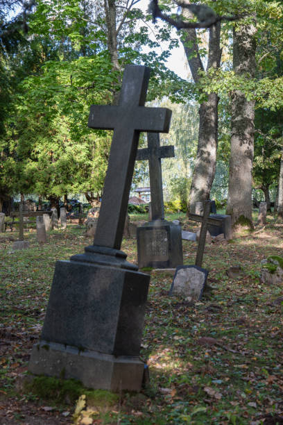 istock Old abandoned cemetery. Old stone crosses on graves. 2176085388