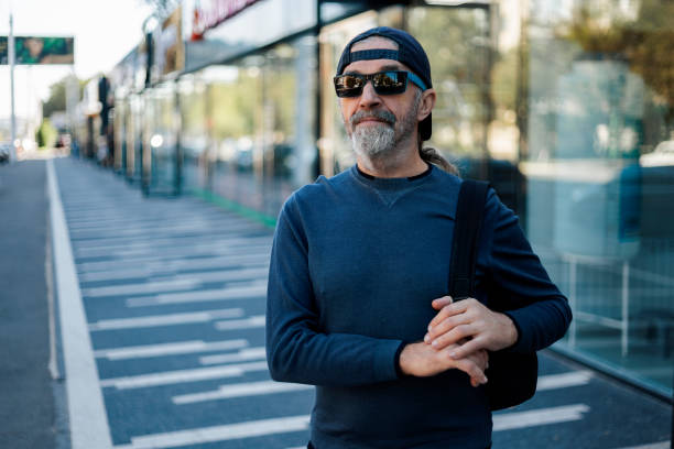 istock Man wearing sunglasses walks with a sure step. 2176087193