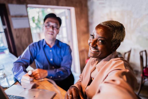 istock Coworkers taking a selfie at restaurant 2176094018