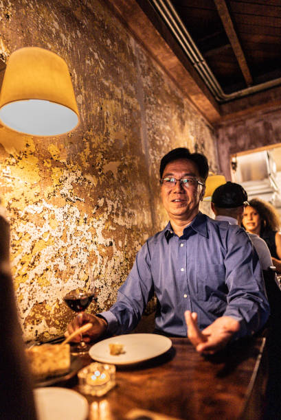 istock Senior man talking to wife during dinner at restaurant 2176094420