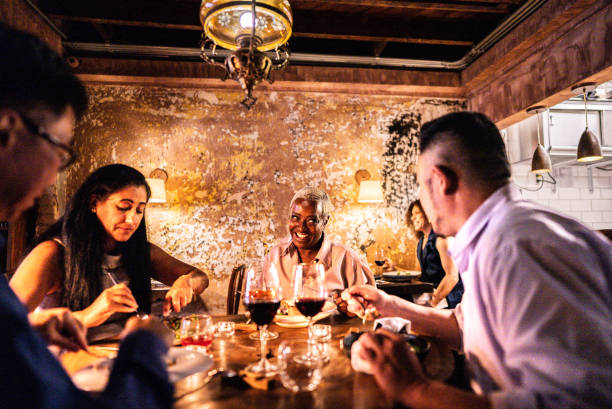 istock Coworkers eating during dinner at restaurant 2176094472