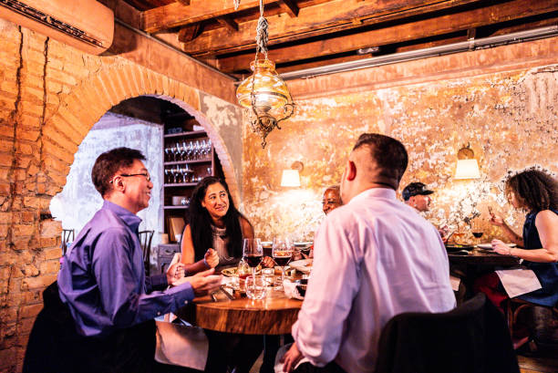 istock Coworkers eating during dinner at restaurant 2176094474