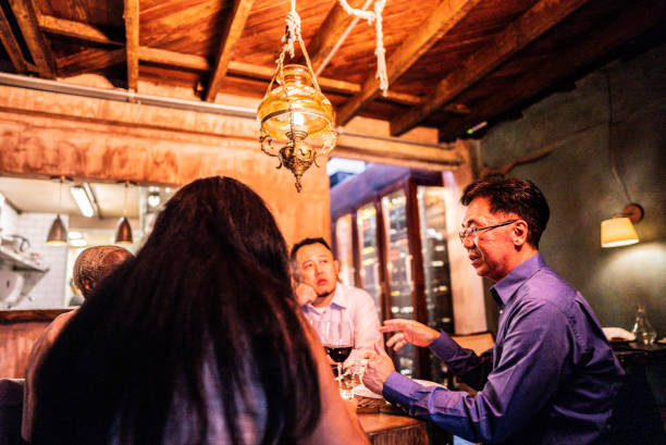 istock Coworkers talking and eating during dinner at restaurant 2176094522