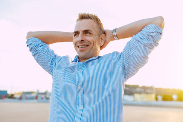 istock Young cheerful business man with hands on head 2176094718