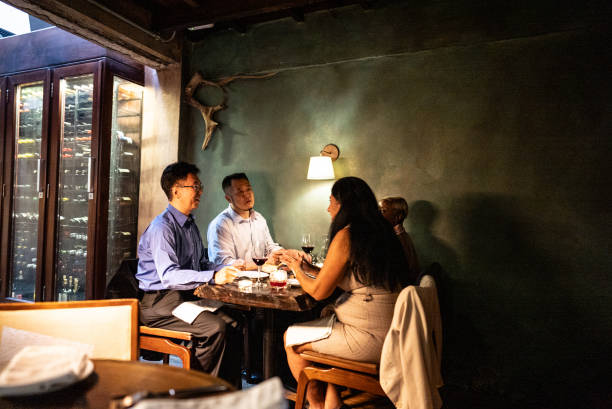 istock Coworkers talking during dinner at restaurant 2176094810