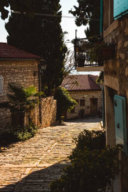 istock Charming stone-paved alleyway in a Mediterranean village 2176096733