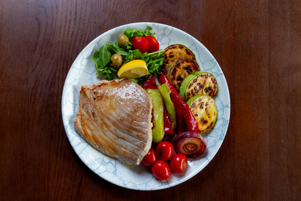 Cut grilled turkey steak on a cutting board