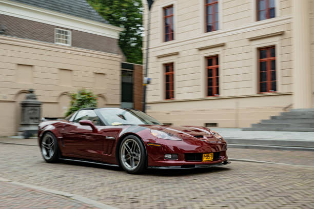 Chevrolet Corvette (C6) sports car driving on the street in Zwolle during a charity event.