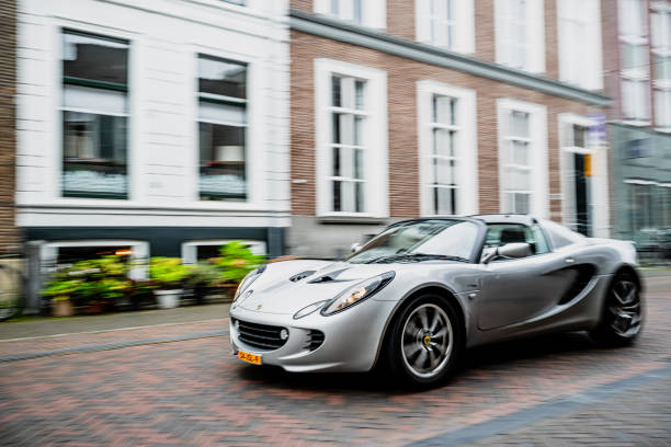 Lotus Elise compact sports car driving on the street in Zwolle during a charity event.