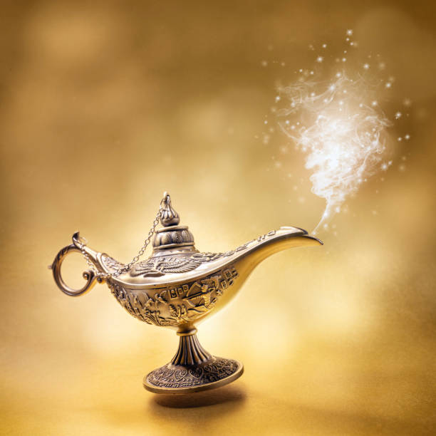 istock Magic Aladdins Genie lamp on gold background 2176099301