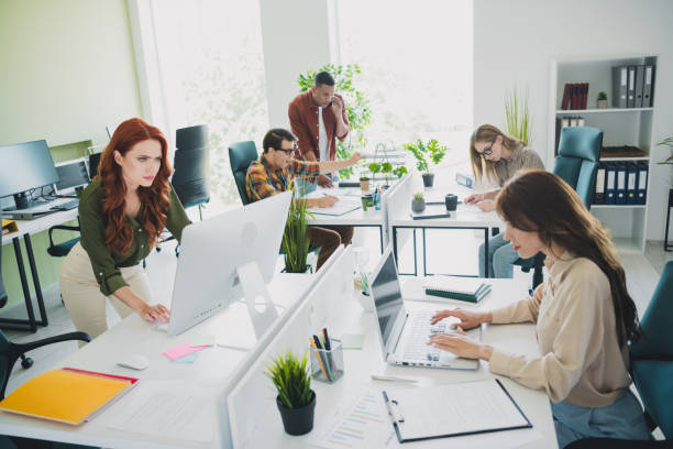 istock Photo of group young corporate workers develop project workstation office business center indoors 2176102834
