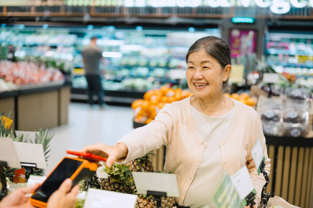 istock Asian Chinese woman paying with smartphone. 2176103564