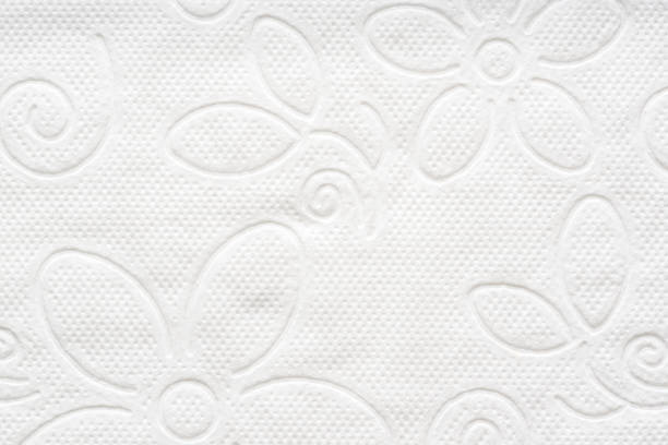 White toilet paper texture with floral pattern used in toilet
