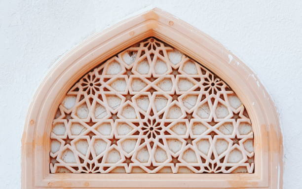 istock Intricate Stone Lattice Window Arch Close-Up View 2176104170