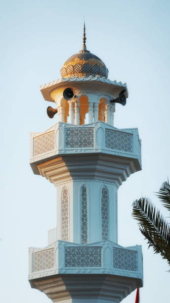 istock Ornate White Minaret Under Clear Sky Close-Up View 2176104182