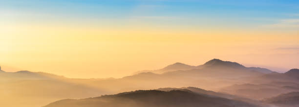 istock Mountain range panorama in sunrise sky, mountain ridge in sunlight. 2176105754
