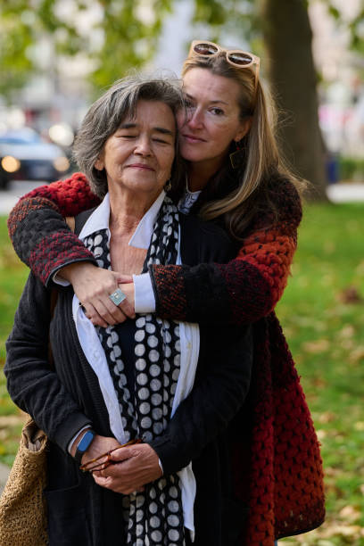 istock A Heartfelt Embrace: A Daughters Support for Her Mother on a Beautiful Autumn Day. 2176106119