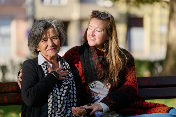 istock Embracing Generations: A Daughter's Love and Support for Her Senior Mother on a Sunny Day in the Park 2176108268