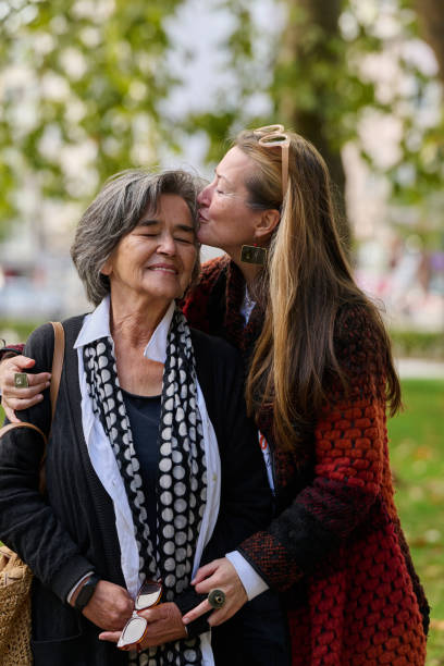 istock A Heartfelt Embrace: A Daughters Support for Her Mother on a Beautiful Autumn Day. 2176109473
