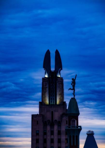 istock Building silhouette with statue against twilight sky 2176109501