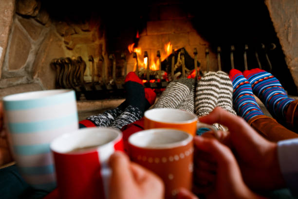 istock Friends sitting by the fireplace 2176109890