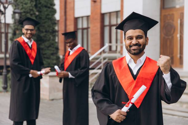 istock Three Graduating Students Celebrating Their Success with Diplomas Outdoors at University Campus 2176109962