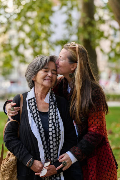 istock A Heartfelt Embrace: A Daughters Support for Her Mother on a Beautiful Autumn Day. 2176111196