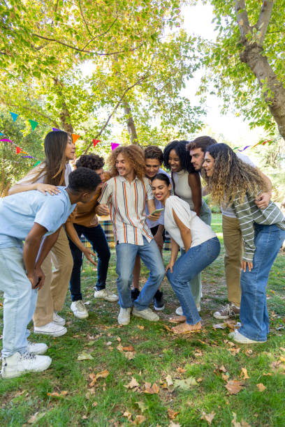 istock Group of friends having fun taking selfie outdoors in the park 2176111539