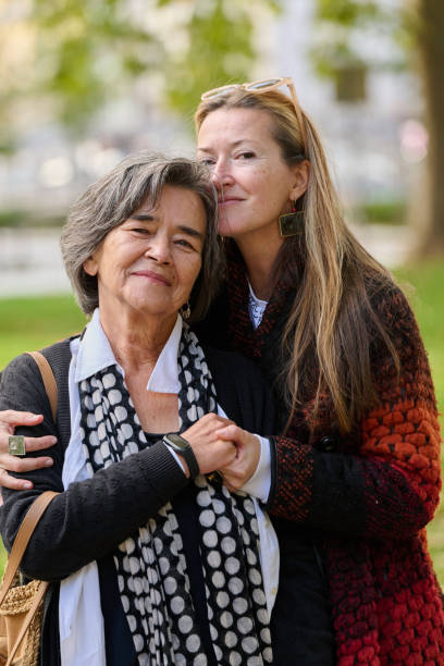 istock A Heartfelt Embrace: A Daughters Support for Her Mother on a Beautiful Autumn Day. 2176112110
