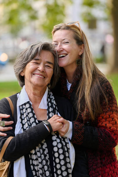 istock A Heartfelt Embrace: A Daughters Support for Her Mother on a Beautiful Autumn Day. 2176112340