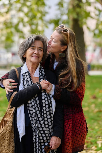 istock A Heartfelt Embrace: A Daughters Support for Her Mother on a Beautiful Autumn Day. 2176112564