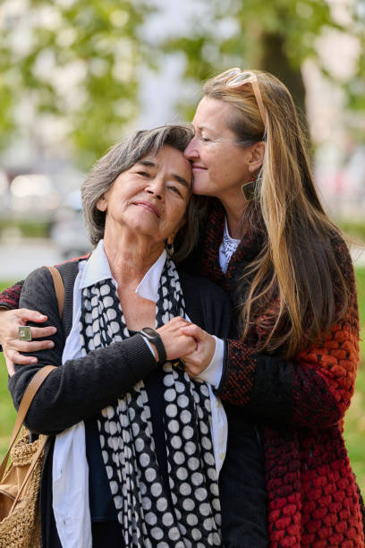 istock A Heartfelt Embrace: A Daughters Support for Her Mother on a Beautiful Autumn Day. 2176112677