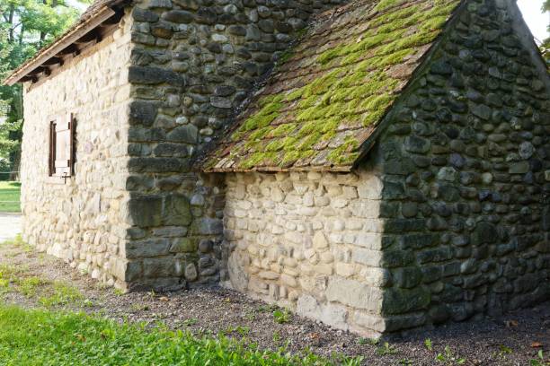 istock Rustic stone building with a moss-covered roof set in Reichenau, Germany 2176116895