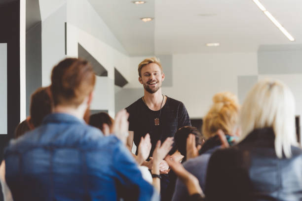 istock Seminar for students, young teacher giving a lecture 2176121234