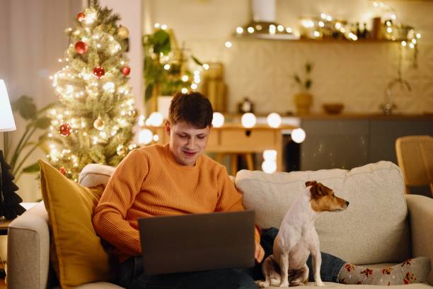 istock Man doing online shopping on New Years Eve 2176128387