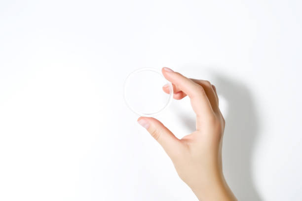istock female hand holding hormonal contraceptive ring on a white background 2176129123