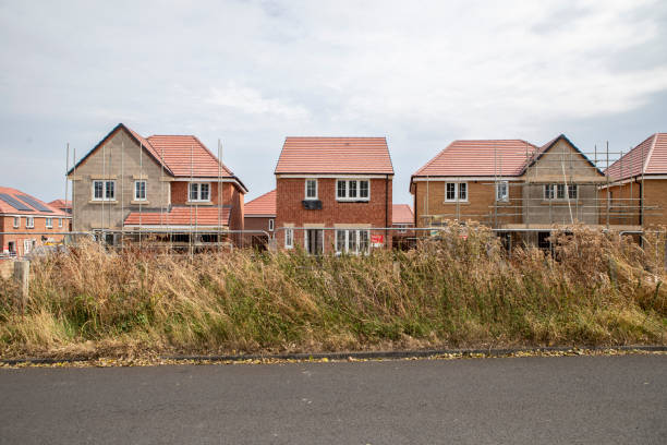istock Nearly completed new houses in a row 2176130115